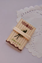 Narrow beige satin ribbon (6mm, 2 Metres) wrapped tightly across a "Sunlit Hugs" card, highlighting the sleek, smooth texture.