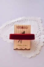 Wide cherry red velvet ribbon (15mm, 2 Metres) wrapped tightly around a "Sunlit Hugs" card on a white lace doily.