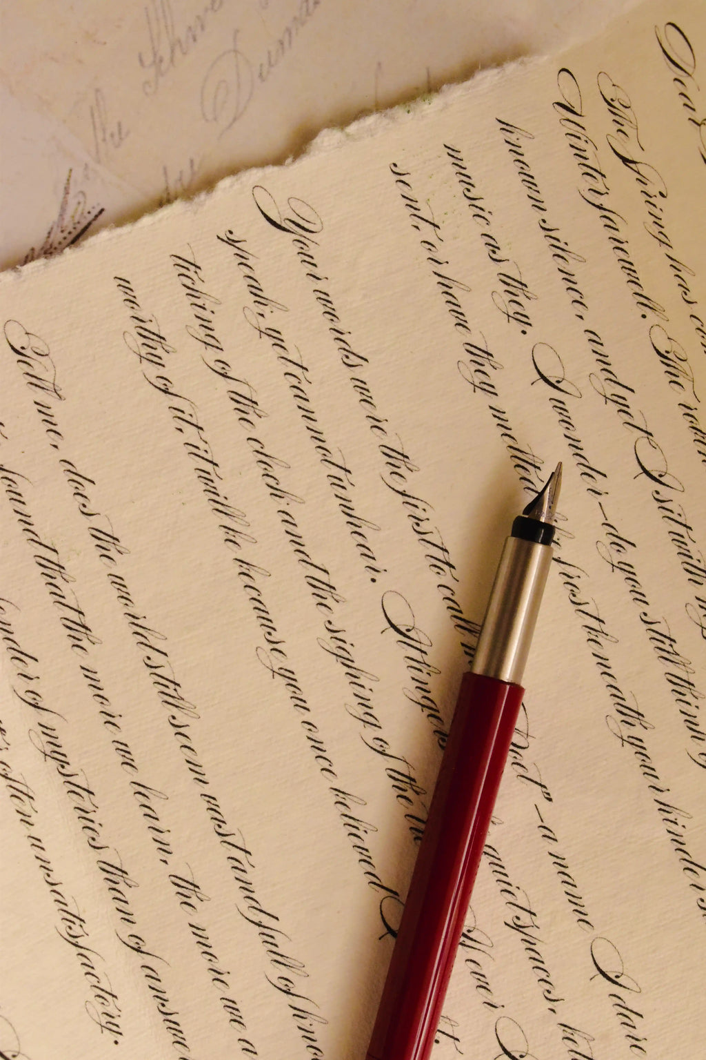 This intimate image captures the detail of the elegant vintage calligraphy style and the quality of the handmade paper, celebrating the heartfelt nature of a written message.