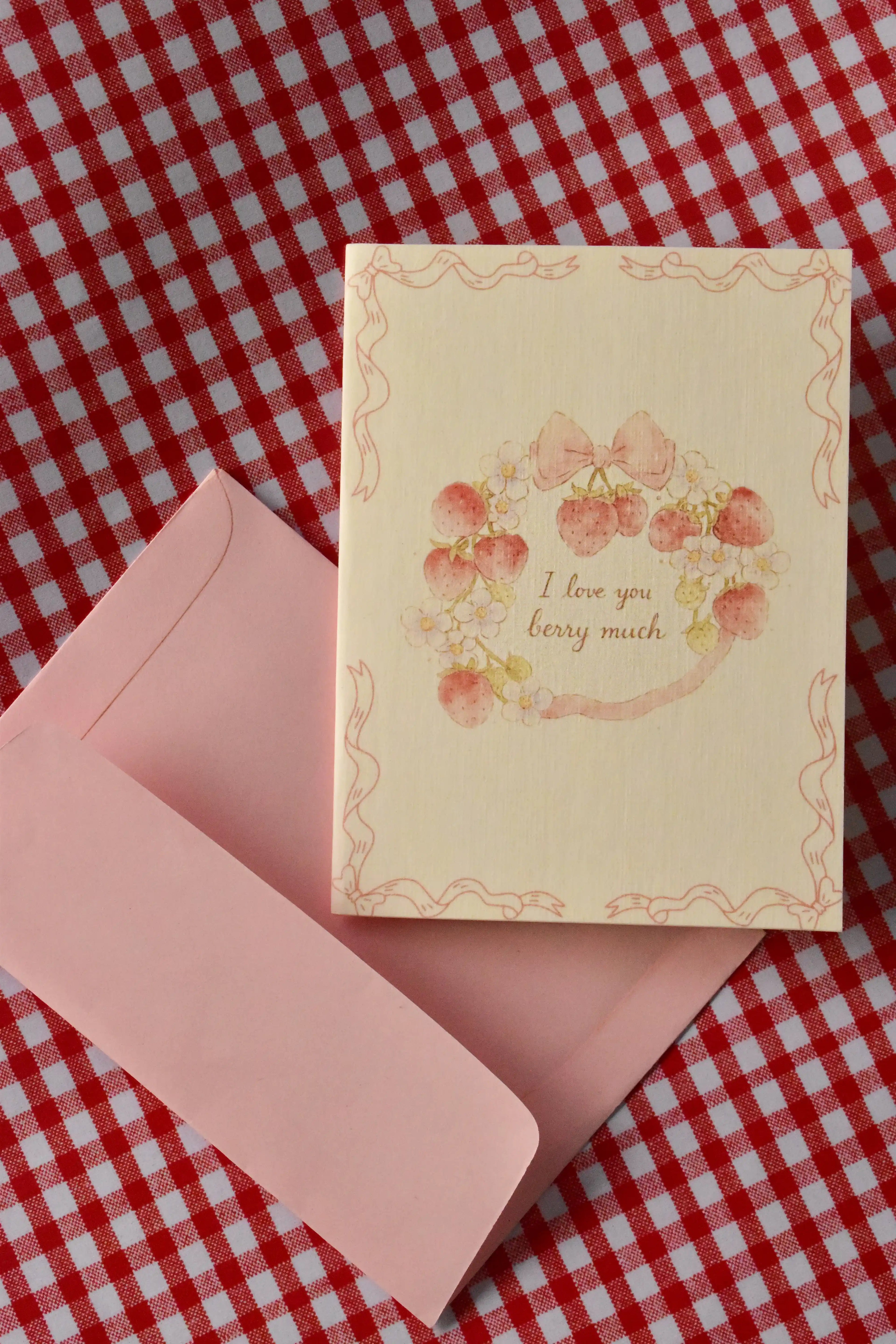 A close-up of the Love You Berry Much card, highlighting the sweet strawberry wreath and bow design—the perfect way to send a cheerful note of affection to a loved one.