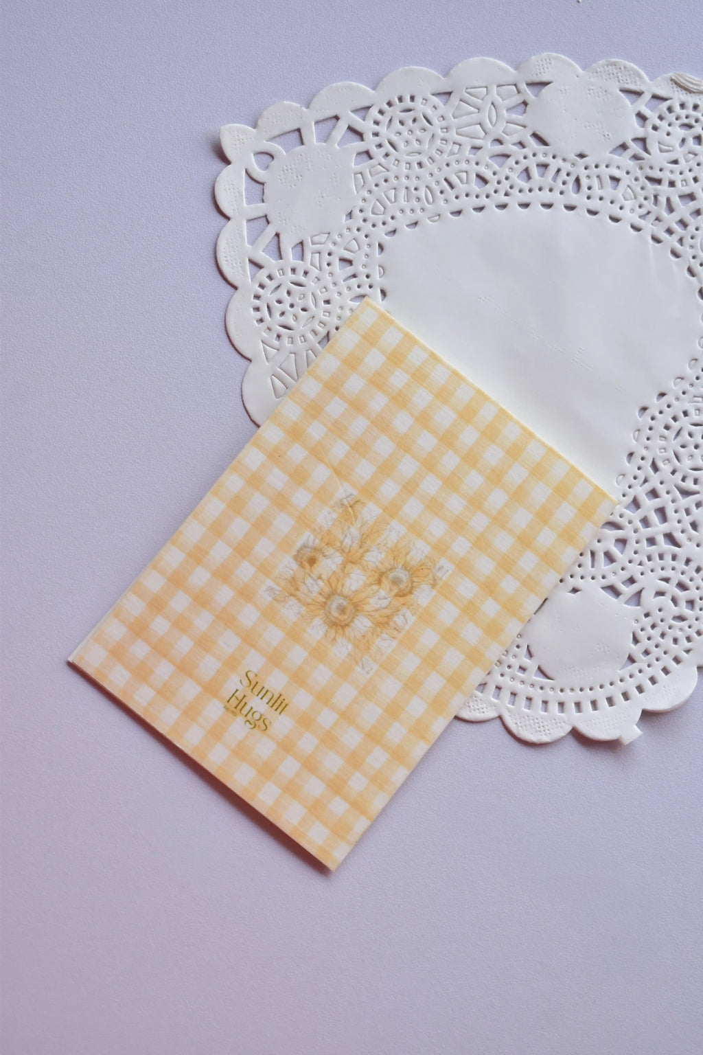 Back of the Mini Birthday Sunshine Card featuring a subtle sunflower cluster illustration on a yellow and cream gingham background.